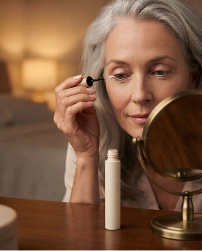 Applying NUVAE serum along the upper lash line